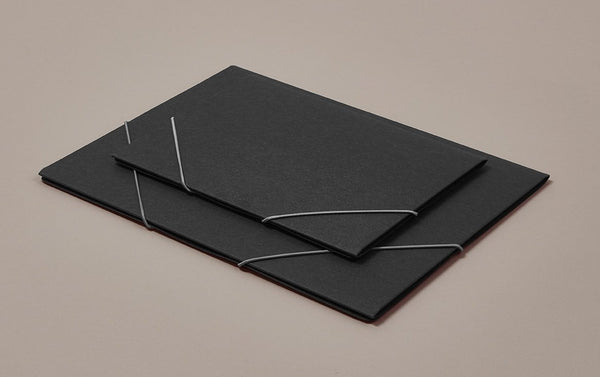 Charcoal black "chemise" portfolio folder with grey elastic